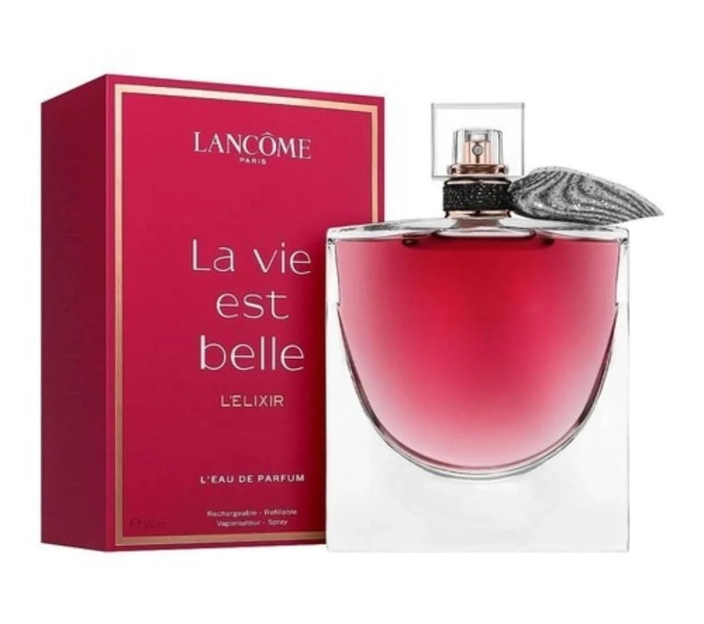 Lancôme La Vie Est Belle L'Elixir perfume bottle with a pink-red liquid and a gray feather accent, shown next to its red packaging box with gold trim on a white background.